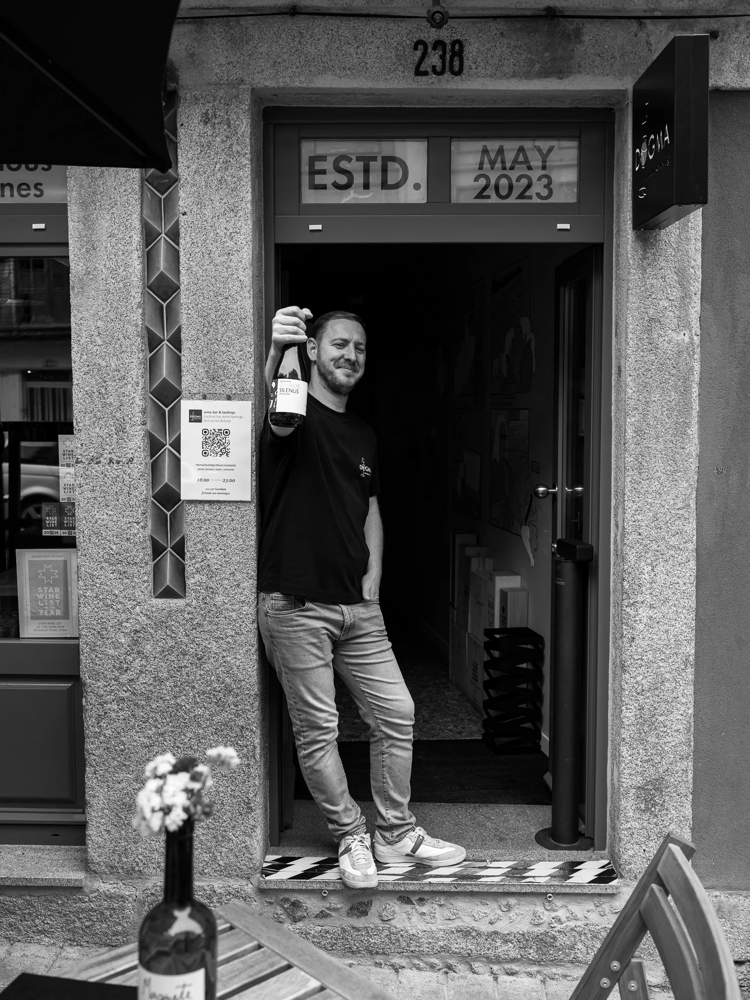 The doorway of Dogma Wine Bar at number 238, established May 2023