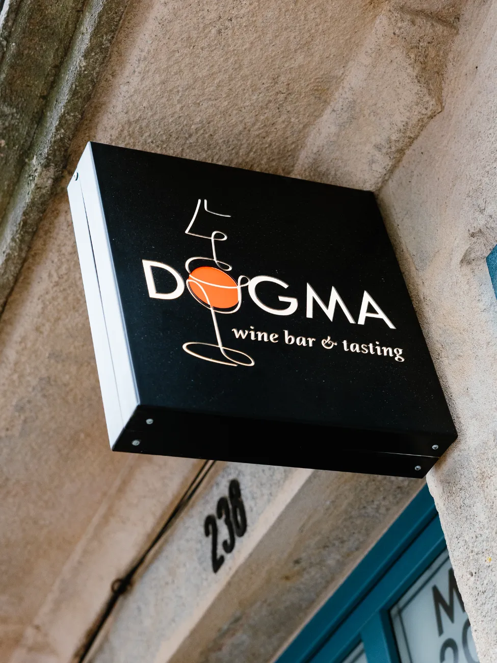 The Dogma wine bar & tasting sign at number 238