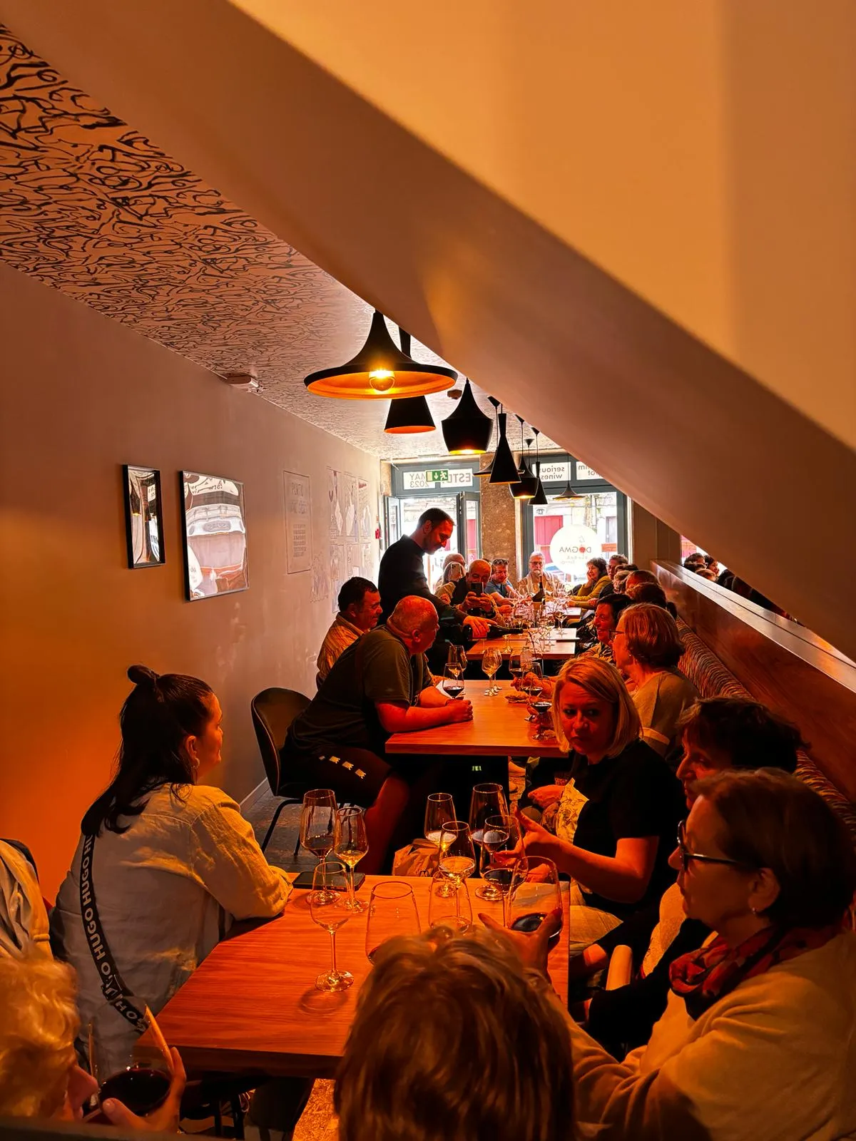 Guests gathered for an evening of Port tasting at Dogma, under warm light